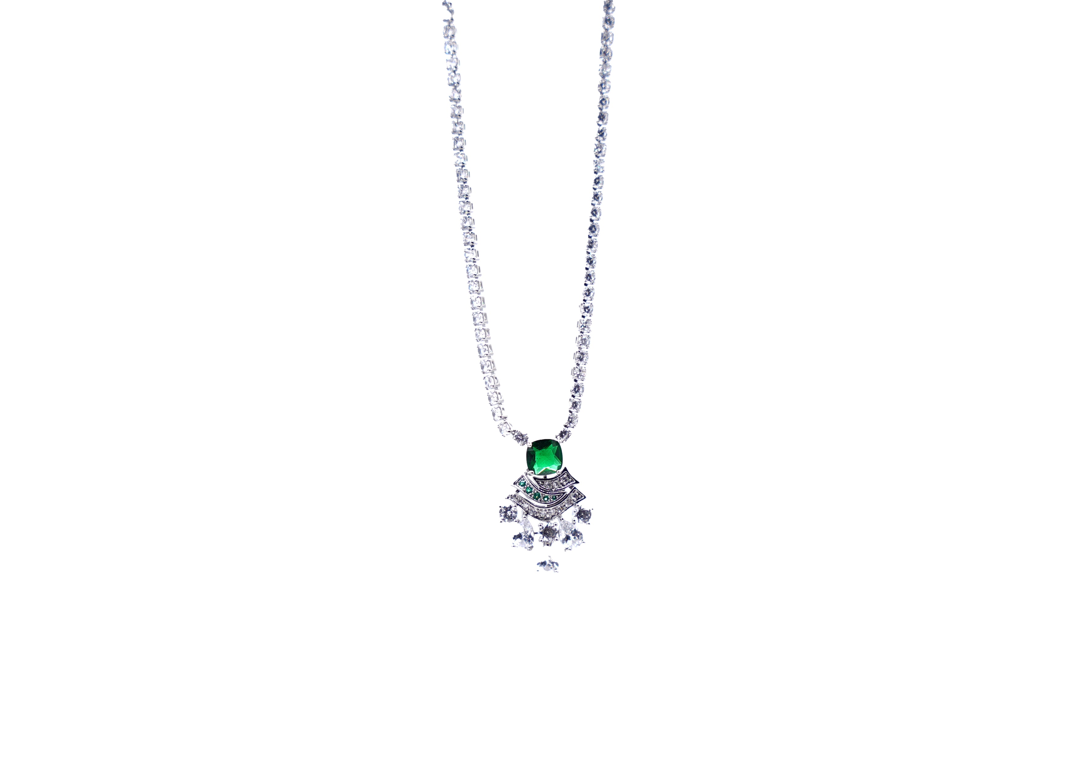 Necklace with a big green gemstone pendant a white background