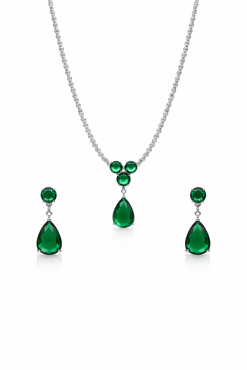Emerald necklace and earrings set on a white background