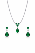 Emerald necklace and earrings set on a white background