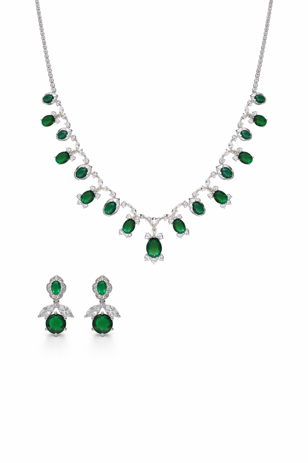 Emerald necklace and earrings set on a white background