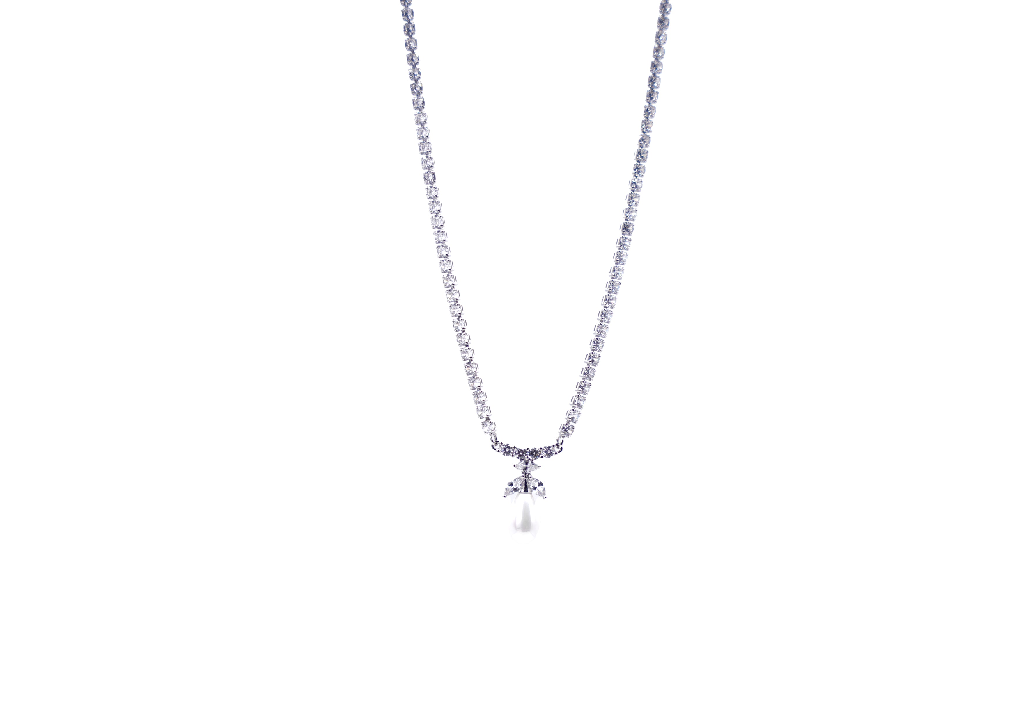 Necklace with a small pendant of a white pearl on a white background