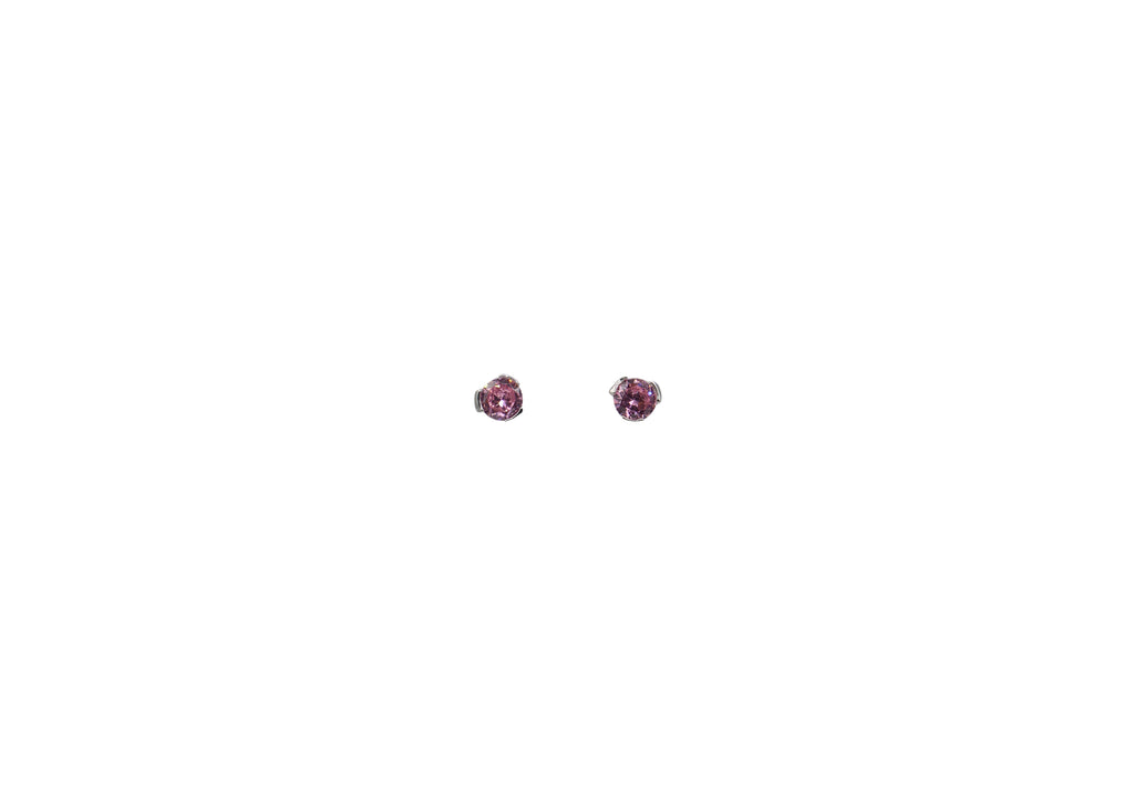 Pair of pink stud earrings on a white background
