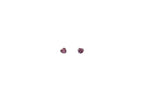Pair of pink stud earrings on a white background