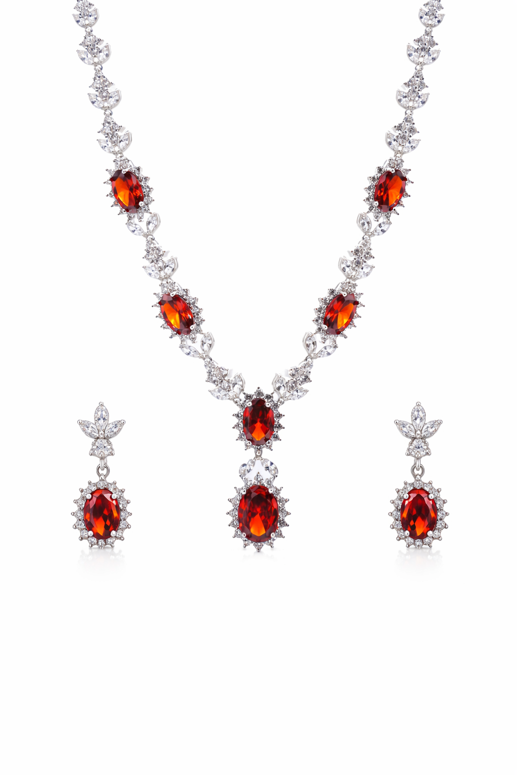 Jewelry set with red gemstones and silver accents on a white background